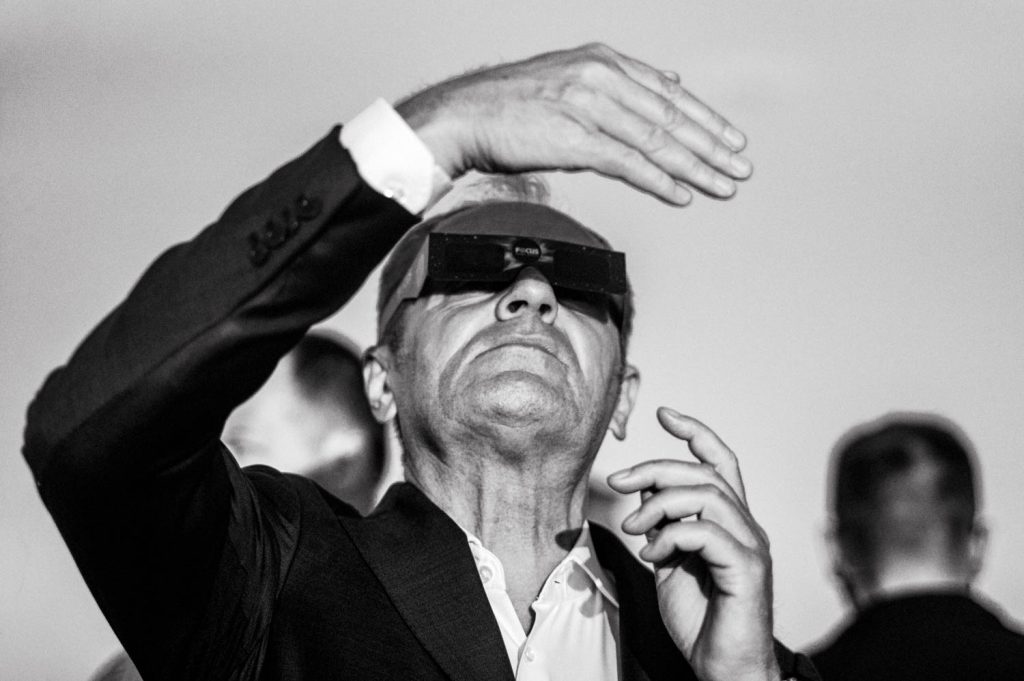 Prime Minister Donald Tusk viewing the partial solar eclipse.